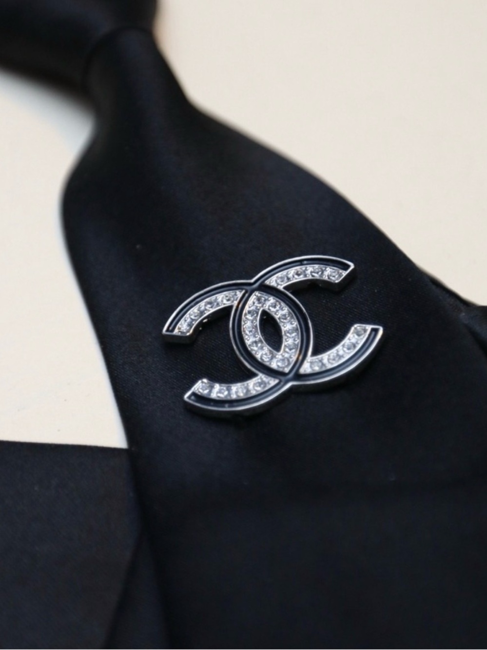 Silver Crystal CC Logo Pin on Black